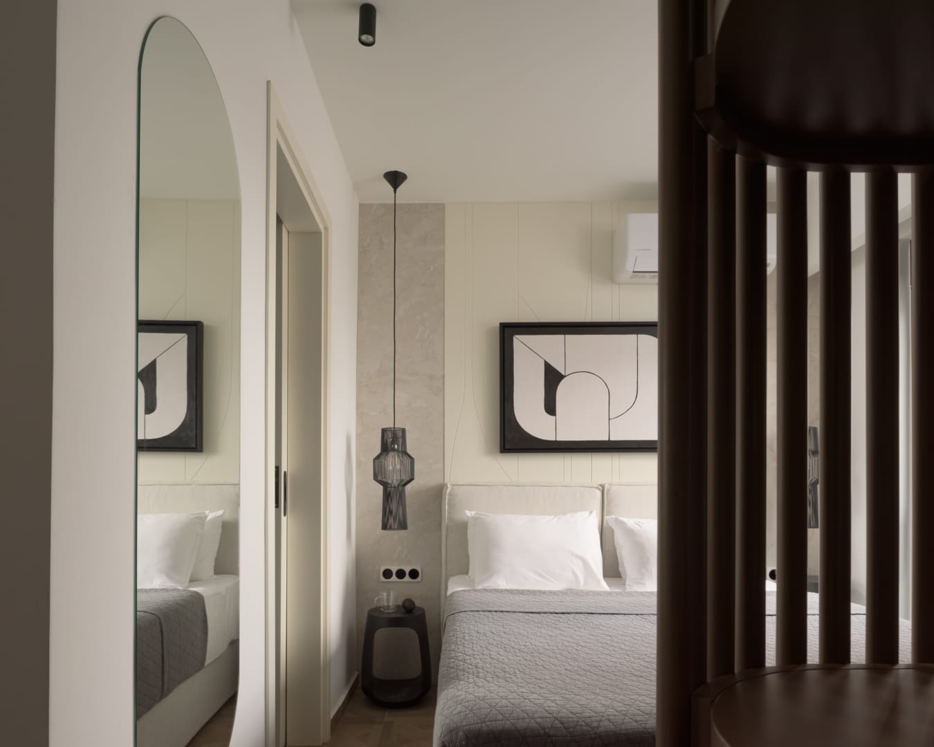 Suite bedroom with arched mirror